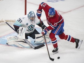 Canadiens' Ryan Poehling moves in on Seattle Kraken goaltender Philipp Grubauer during first period NHL hockey action in Montreal, on Saturday, March 12, 2022.