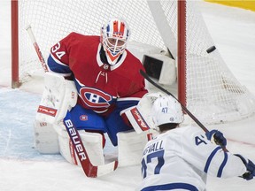 Toronto Maple Leafs' Pierre Engvall (47) takes a shot on Canadiens goaltender Jake Allen during first period NHL hockey action in Montreal on Saturday, March 26, 2022.