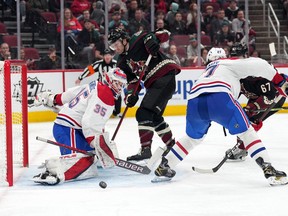 Coyotes right-wing Christian Fischer shoots against Montreal Canadiens goaltender Sam Montembeault during the third period at Gila River Arena in Glendale, Ariz., on Jan. 17, 2022
