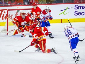 Calgary Flames goaltender Jacob Markstrom (25) makes a save against Montreal Canadiens centre Mike Hoffman (68) during the first period at the Scotiabank Saddledome.