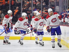 Montreal Canadiens centre Nick Suzuki (14) celebrates his goal with teammates against the Philadelphia Flyers during the second period at the Wells Fargo Center in Philadelphia on March 13, 2022.