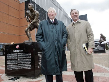 Former Montreal Canadiens greats Guy Lafleur (right) and Jean BÈliveau stand on the Montreal Canadiens Centennial Plaza at the inauguration of the plaza Thursday, December 4, 2008. The event was part of the 100th anniversary celebrations of the storied hockey club. On the left is a sculpture of BÈliveay and in the right background is a sculpture of Lafleur.