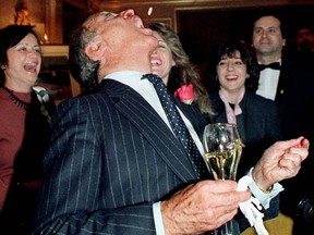 Former prime minister Pierre Trudeau catches a nut in his mouth during a book launch at the Ritz-Carlton Hotel in March 1985.