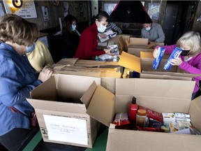 Volunteers sort a steady stream of donations bound for Ukraine as Montrealers drop off items at Duffy's pub on Sunday, March 13, 2022.