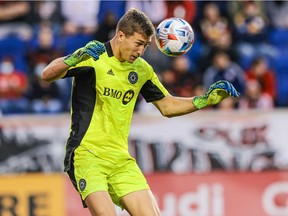 CF Montréal goalkeeper Sebastian Breza heads the ball during the second half against the New York Red Bulls at Red Bull Arena in Harrison, N.J., on Oct. 30, 2021