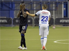 CF Montreal forward Kei Kamara (23) and Cruz Azul defender Alejandro Mayorga (2) at the end of the match at Olympic Stadium March 16, 2022.