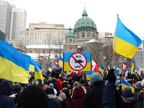 Demonstrators protest against Russia's invasion of Ukraine, at Place du Canada in Montreal on Feb. 27, 2022.