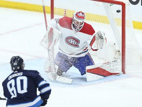 Winnipeg Jets centre Pierre-Luc Dubois beats Montreal Canadiens goaltender Sam Montembeault high glove side in Winnipeg on Tuesday, March 1, 2022.