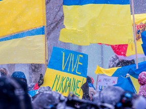 Supporters of Ukraine gather at Place du Canada in Montreal on Sunday February 27, 2022 to protest the Russian invasion.