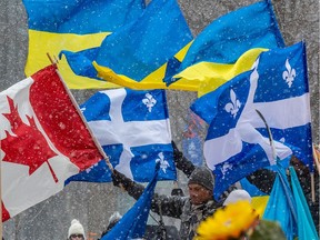 Supporters gather at Place du Canada in Montreal on Sunday February 27, 2022 to protest against the Russian invasion of Ukraine. The news from Ukraine has her reflecting on nationalism, Lise Ravary writes, though "never in a million years would I compare the situation with respect to Canada and Quebec to the one involving Russia and Ukraine."