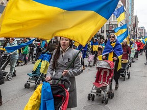 Ukraine supporters marched through the streets of Montreal on Saturday, March 26, 2022.