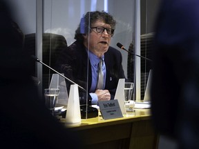 Pointe-Claire Mayor Tim Thomas speaks during a special meeting at city hall on April 19.