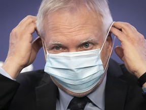 Quebec public health director Dr. Luc Boileau puts on his mask following a press conference on COVID-19 in Montreal on Thursday March 10, 2022. "Masks and social distancing have proven effective," Fariha Naqvi-Mohamed notes.