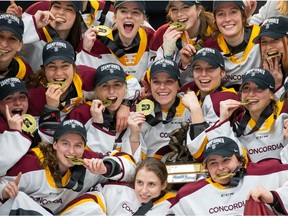 The Concordia University hockey team celebrates after winning the Canadian university championship on March 27, 2022, in Charlottetown.