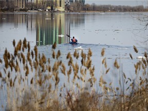 With little to no risk of flooding, most of the ice broken up and flowing downstream, a kayaker enjoys a calm Rivière-des-Prairies, April 5, 2022.