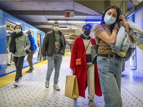 Transit users at Peel métro station April 5, 2022.