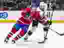 Montreal Canadiens centre Christian Dvorak competes against Ottawa Senators' Travis Hamonic during third period in Montreal on April 5, 2022.