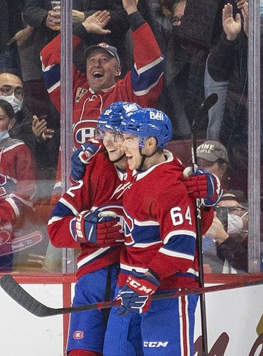 Montreal Canadiens' Justin Barron, left, celebrates his first career goal with teammate Corey Schueneman during second period of National Hockey League game against the Ottawa Senators  in Montreal Tuesday, April 5, 2022.