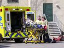 Paramedics on the scene at Maison Herron in Dorval on April 8, 2020.