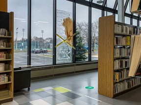 A bullet shattered the window of the Jean Corbeil public library on Wednesday night as gunfire erupted in Anjou.