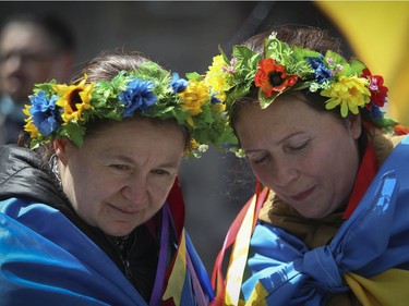 Zhanna Havrylyuk (right) a refugee from Kyiv, Ukraine, and Nina Fedorinova, a Montreal resident, attend a rally Saturday, April 16, 2022. in Old Montreal in support of Ukraine.