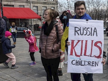 Vera and Anton Seletska take part in a rally Saturday, April 16, 2022, in Montreal in support of Ukraine.