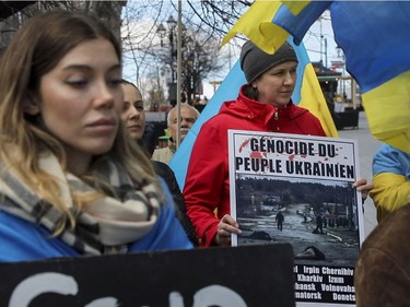 People take part in a gathering Saturday, April 16, 2022, in Montreal in support of Ukraine.