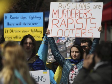 People take part in a rally Saturday, April 16, 2022, in Old Montreal in support of Ukraine.