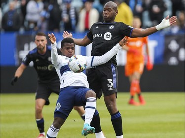 Kamal Miller of CF Montréal towers over Déiber Caicedo of the Vancouver Whitecaps FC in MLS play Saturday, April 16, 2022, at Saputo Stadium.