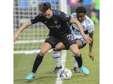 Lassi Lappalainen of CF Montréal protects the ball on the end line against Javain Brown of the Vancouver Whitecaps FC in MLS play Saturday, April 16, 2022, at Saputo Stadium.