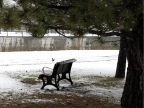 A snow-covered park bench sits empty after Montreal got one last (?) blast of snow and rain April 19, 2022.