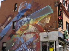 A mural honouring Jackie Robinson is located on the side the Plateau landmark restaurant Coco Rico in Montreal, on Wednesday, April 20, 2022.