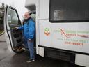 Gerry Lafferty, executive director of New Hope Senior Citizens' Centre with the bus of the organization on Wednesday April 27, 2022. The bus has had its catalytic converter stolen for the second time in the past few weeks.