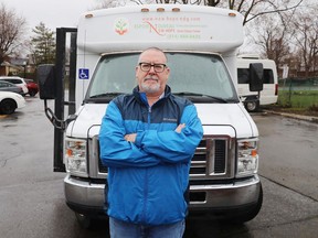 Gerry Lafferty, executive director of New Hope Senior Citizens' Centre, with the bus of the organization on Wednesday April 27, 2022. The bus has had its catalytic converter stolen for the second time in less than a year.