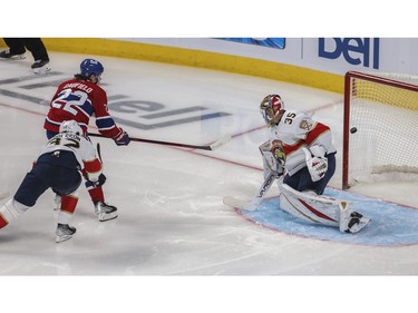 Canadiens' Cole Caufield scores a goal against goalie Jonas Johansson against the Florida Panthers at the Bell Centre in Montreal on Friday, April 29, 2022. Defending is Lucas Carlsson.