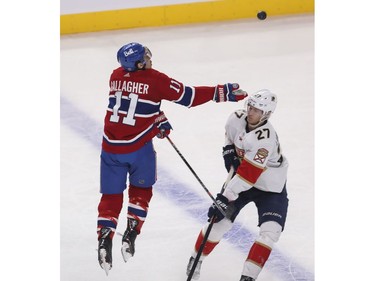 Canadiens' Brendan Gallagher jumps for a puck in front of Eetu Luostarinen of the Florida Panthers at the Bell Centre in Montreal on Friday, April 29, 2022.