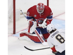 Canadiens goaltender Carey Price makes a save off of Ben Chiarot of the Florida Panthers in the second period  at the Bell Centre in Montreal on Friday, April 29, 2022. It was the last game of the season for the Canadiens.