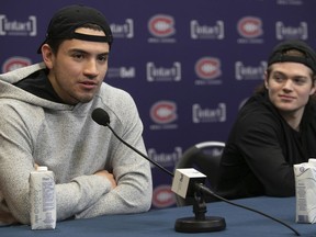 Nick Suzuki (left) and Cole Caufield answer questions during the Canadiens' post-mortem press conference Saturday at the Bell Sports Complex in Brossard.
