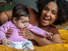 Arantza Laberdesque with 2-month-old Océane Lacasse at home in Longueuil.