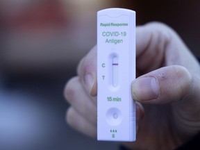 A negative rapid test is seen in Montreal, on Friday, December 24, 2021.