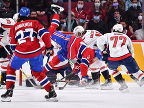 Canadiens' Ryan Poehling falls after being hit during the first period against the Washington Capitals at the Bell Centre on Saturday, April 16, 2022, in Montreal.