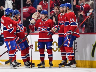 Candiens' Cole Caufield (centre) celebrates his goal with teammates Mike Hoffman (68), Nick Suzuki (14), Jeff Petry (26) and Joel Edmundson (44) during the first period against the Florida Panthers at the Bell Centre on Friday, April 29, 2022, in Montreal.