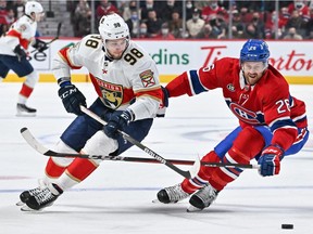 Maxim Mamin (98) of the Florida Panthers skates the puck against Canadiens' Jeff Petry during the first period at the Bell Centre on Friday, April 29, 2022, in Montreal.