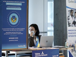 A stand at Pierre Elliott Trudeau Airport is set up to receive potential Ukrainian refugees.