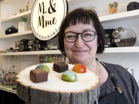 M. & Mme Chocolat co-owner Jenny Ann Laprise displays some of the offerings in her Beaubien St. E. shop.