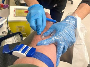 A donor gives blood at a Canadian Blood Services donation centre.