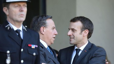 Quebec Premier François Legault shakes hands with French President Emmanuel Macron following a state lunch at the Élysée Palace in Paris on Jan. 21, 2019.