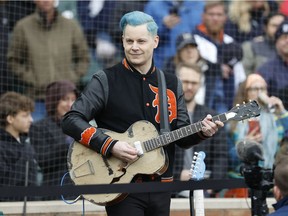 Jack White performs the U.S. national anthem before a game between the Detroit Tigers and the Chicago White Sox on Friday, April 8, 2022.