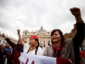 Women from Canada's First Nations gesture in St. Peter's Square, after an audience with Pope Francis, at the Vatican, April 1, 2022.