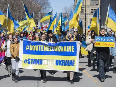 People take part in a rally in support of Ukraine in Montreal on Saturday, April 2, 2022.